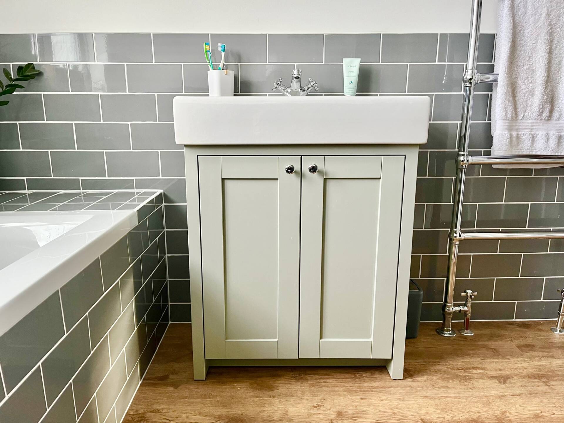 Grey bathroom grey metro tiles Tavistock sink unit