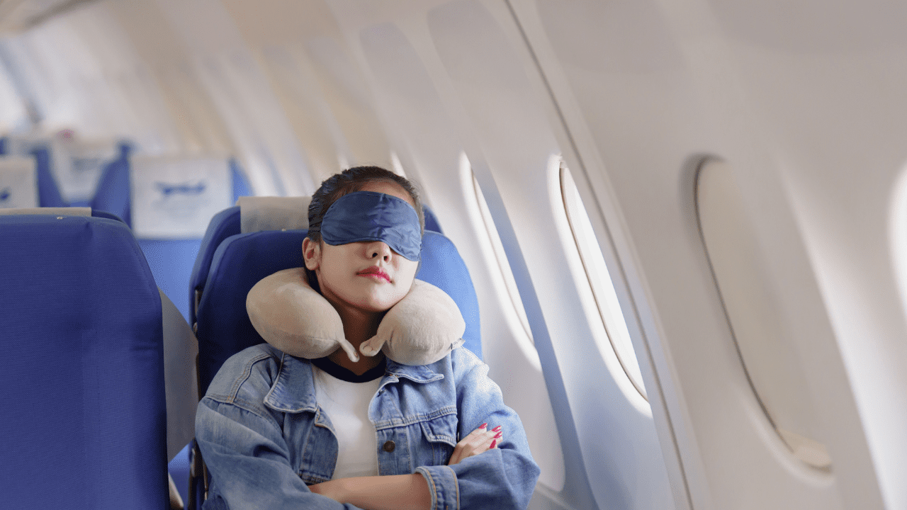 child asleep on plane